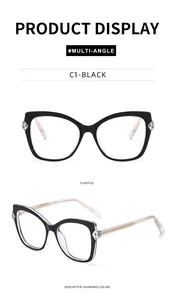 Detail view of black cat-eye glasses frame with intricate woven gold metal temples