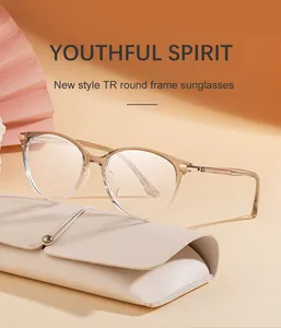 Detail of round TR90 frames in light tea color with a stylish leather drawstring pouch