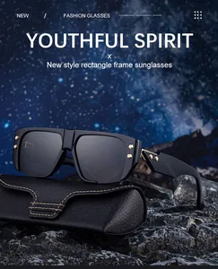 Detail of square black sunglasses with gold rivets and textured leather case