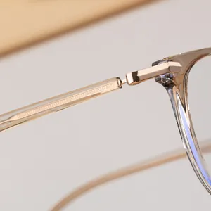 Close-up of durable metal hinges and rose gold core on transparent TR90 cat eye frames