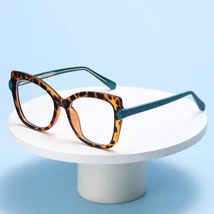 Fashionable cat-eye tortoiseshell and blue frame glasses for women on a display stand