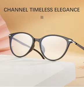 Detail of glossy black cat-eye TR90 frames with silver accents on a minimalist stand