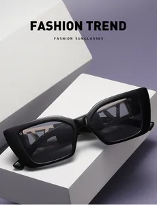 Detail view of square sunglasses with V-shaped metal inlay and matte black finish