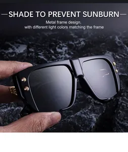 Detail of square black sunglasses showing golden metal rivets and a thick polished frame