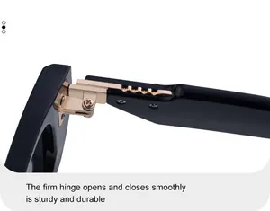 Detail view of the premium golden metal hinge on black square frame sunglasses
