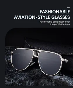 Detail of aviator sunglasses with gunmetal matte frame on dark rock background
