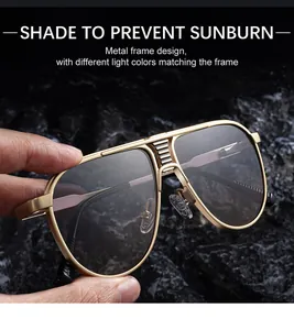 Detail of pilot sunglasses with gold metal frame and gradient lenses on a stone surface