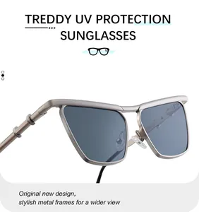 Detail showing matte silver metal frame and square gray lenses with UV protection