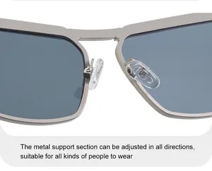Detail of adjustable clear nose pads and silver metal bridge on cat-eye sunglasses