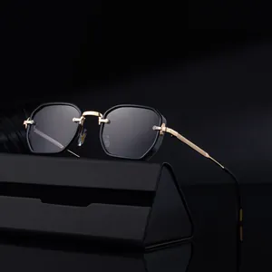 Retro square sunglasses with black frame and gold metal accents on black mirror surface