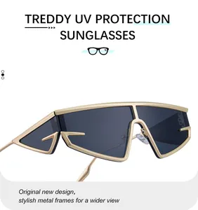 Detail of futuristic gold metal frame cat eye sunglasses with grey UV protection lenses