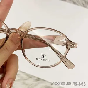 Gafas ópticas ovaladas de moda para mujer con montura marrón ámbar transparente chic