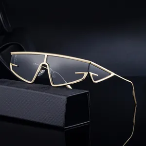 Futuristic gold metal frame oversized wrap-around sunglasses with grey translucent lenses
