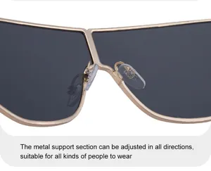 Detail of adjustable metal bridge and soft silicone nose pads on gold sunglasses