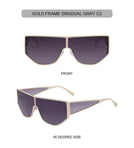 Close-up of golden irregular metal frame sunglasses with gradient gray lenses and hollow temples