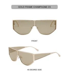 Close-up of golden irregular oversized sunglasses with champagne lenses and side hollow design