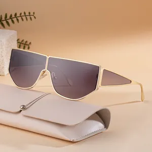 Modern irregular geometric sunglasses with gold metal frame and gradient lenses