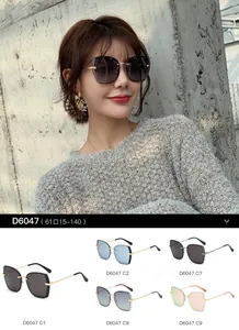 Detail showing frameless cutting edge and metal temples of model D6047 sunglasses
