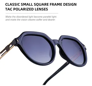Detailed close-up of gold hollowed-out metal temples and polarized lenses of square sunglasses