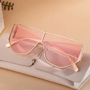 Irregular metal frame sunglasses with peach lenses and luxury leather case