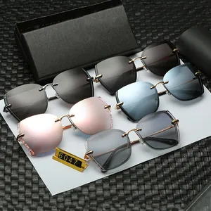 Collection of rimless oversized polarized sunglasses with sleek metal temples in various colors