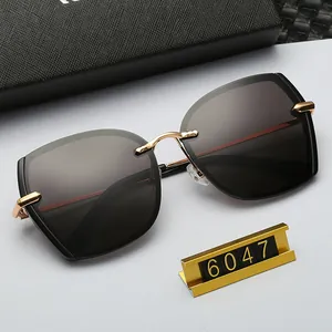 Detail of gradient grey lenses with gold metal frame and black textured case