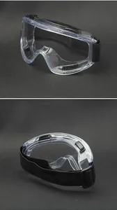 Detail of safety goggles with wide transparent lens and black adjustable elastic headband