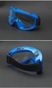 Detail view of blue safety goggles with ventilation ports and adjustable elastic strap