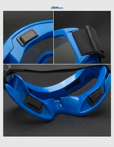 Detail of blue safety goggles showing inner foam padding and adjustable elastic headband