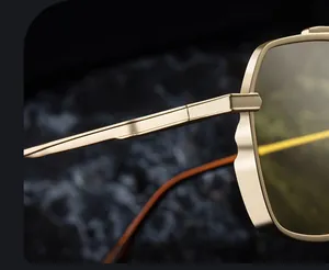 Macro shot of matte gold metal frame with geometric faceted edges and reinforced hinges