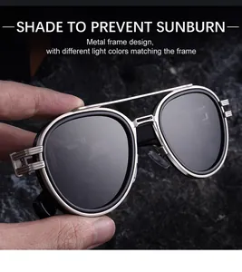 Close-up of retro silver metal frame sunglasses with engraved double bridge detail