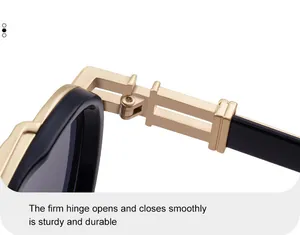 Detailed close-up of sturdy metal hinges on stylish black and gold oval sunglasses