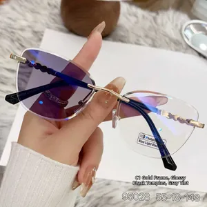 Detail of gold cat-eye glasses with photochromic lenses and blue light protection