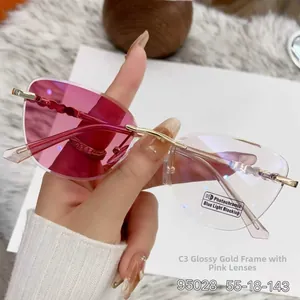 Close-up of cat-eye rimless sunglasses with pink gradient photochromic lenses