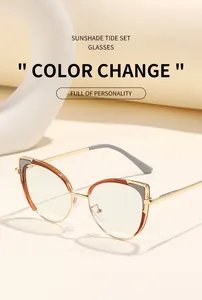 Detailansicht der Cat-Eye-Sonnenbrille mit goldenem Metallrahmen und phototropen Gläsern