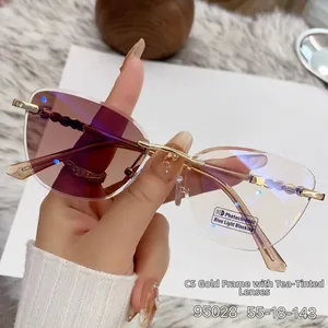 Detail of rimless photochromic sunglasses with wavy metal temples and gold frame finish