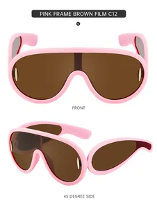 Roze oversized sportzonnebril met bruine glazen en gouden metalen zijaccenten