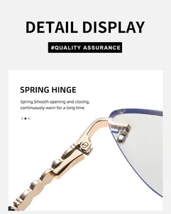 Detail of golden metal spring hinge on rimless cat-eye sunglasses with blue lenses