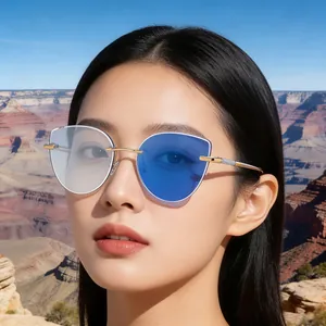 Detail of cat eye rimless sunglasses with blue asymmetric lenses and rhinestone temples