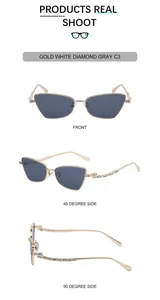 Detail view of gold cat-eye sunglasses with white diamonds and gray lenses for women