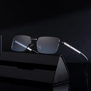 Modern square half-frame sunglasses with metal temples and screw detail over a leather case