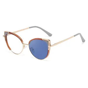 Trendige Cat-Eye Phototrope Sonnenbrille mit goldenem Metallrahmen und Bernstein-Akzenten
