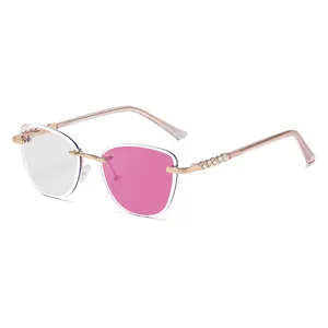 Frameless cat-eye transition sunglasses with rose gold crystal temples and bicolor lenses