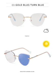 Cat eye photochromic sunglasses with gold frames and blue-tinted lenses in outdoor light