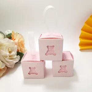 Three pink hollow bear candy boxes with white stripes and translucent ribbons