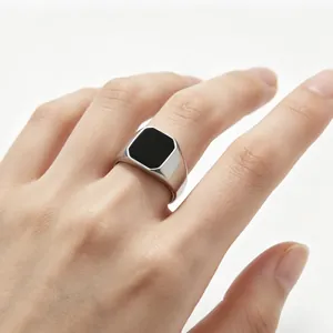 Men's minimalist silver stainless steel signet ring with a sleek rectangular black enamel inlay