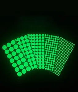 Luminous wall stickers featuring multi-size glowing green round dots on dark background