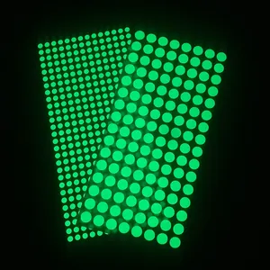 Luminous wall stickers with different sized glow dots in fluorescent green color