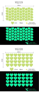 Glow-in-the-dark heart wall stickers showing daytime green and nighttime luminous effect