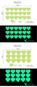 Luminous green heart wall stickers showing size specs for daytime and glow-in-the-dark effects